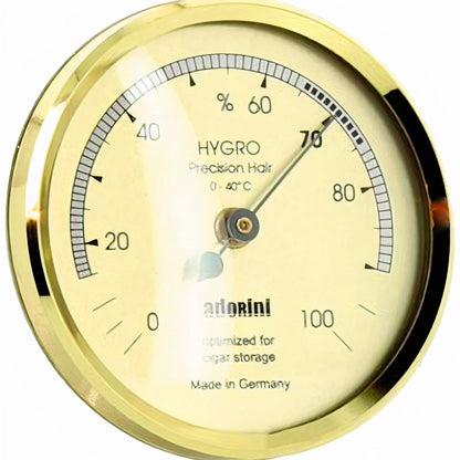 Gold-framed hygrometer with brand name on a white background