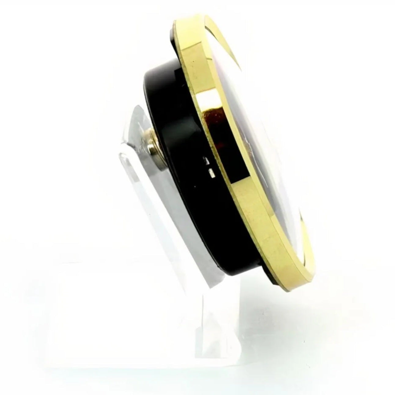 Black and gold circular object on a white background