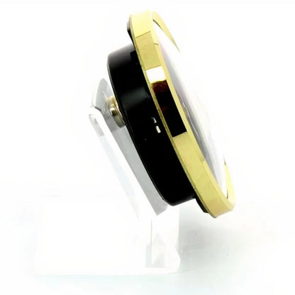 Black and gold circular object on a white background