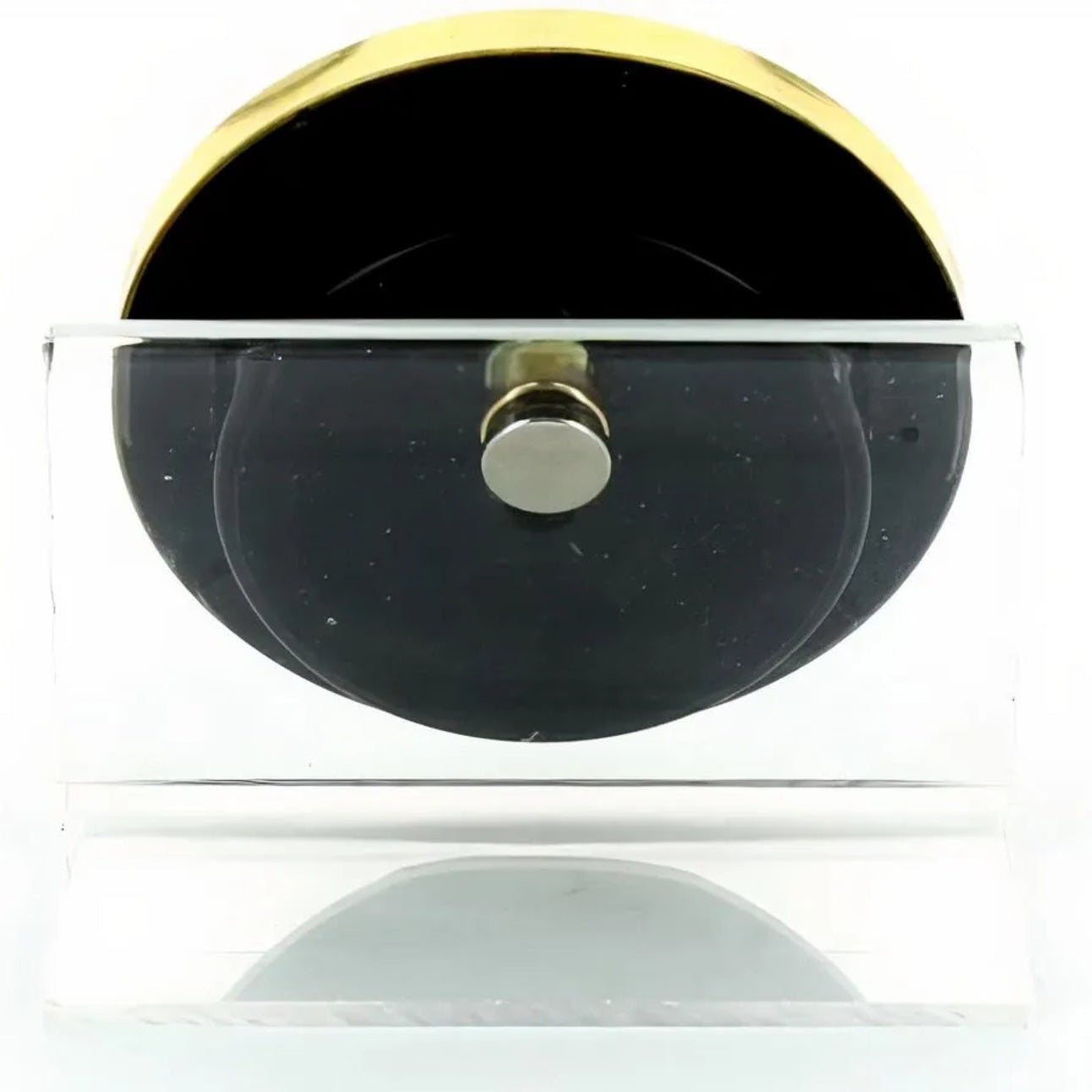 Black HYDRO object with gold accents on a white background