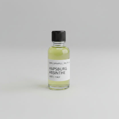 Bottle of Hapsburg Absinthe on a marble surface with arcade games in the background