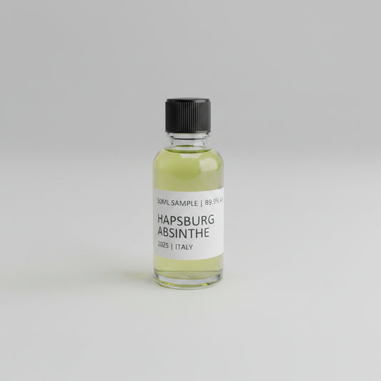 Bottle of Hapsburg Absinthe on a marble surface with arcade games in the background