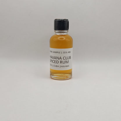 Small bottle of Havana Club Spiced Rum on a light gray background