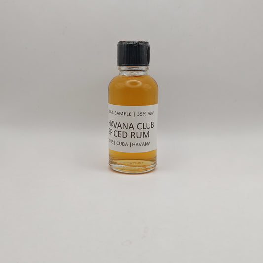 Small bottle of Havana Club Spiced Rum on a light gray background