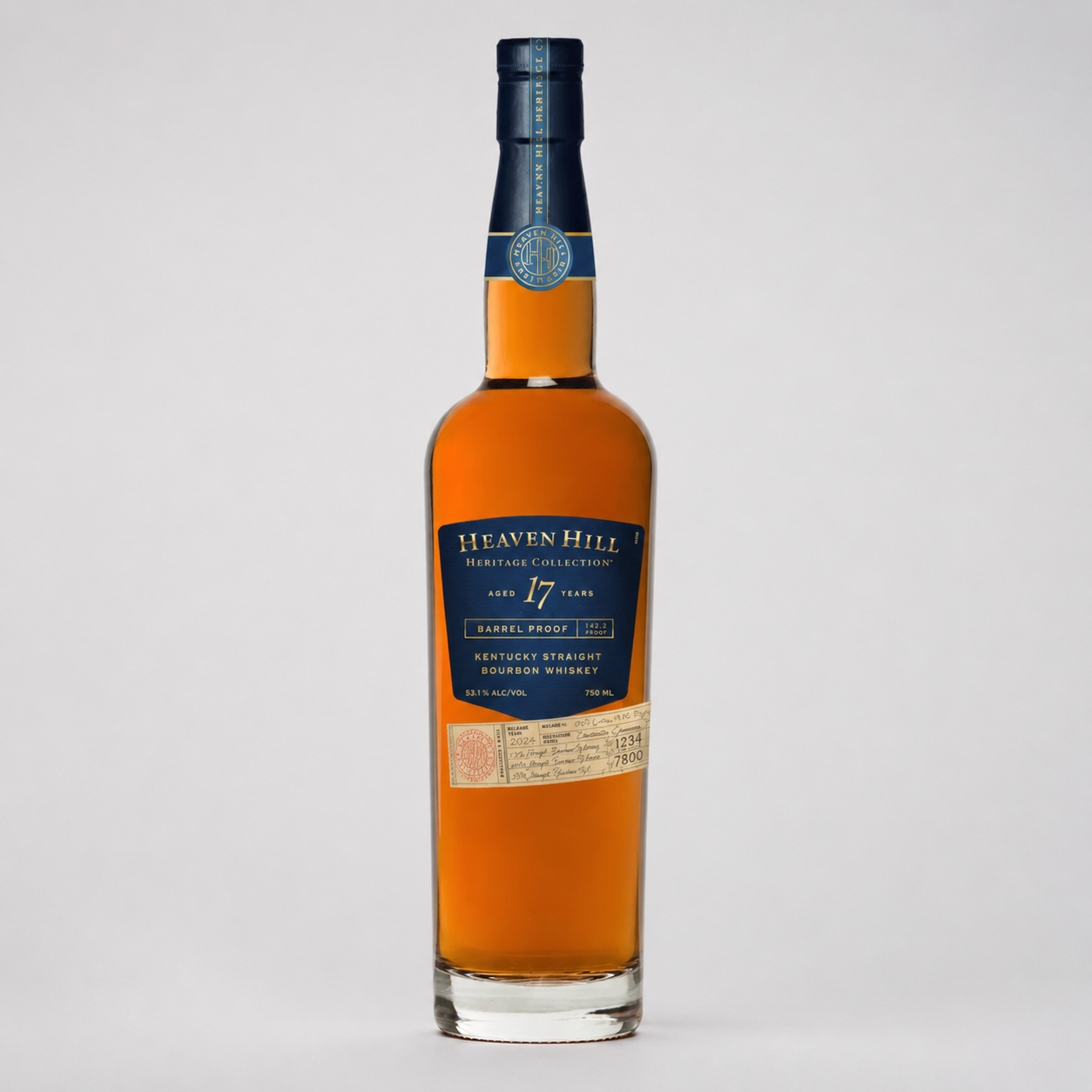 A bottle of Heaven Hill Kentucky Straight Bourbon Whiskey, 17 Years, with amber liquid, a dark blue label, and a dark blue cap, set against a light gray background.