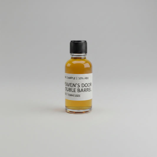 Small bottle of Heaven's door double barrel whiskey on a white background