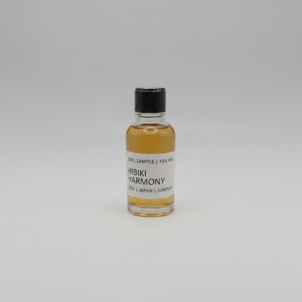 Small bottle of Hibiki Harmony whisky sample on a light gray background