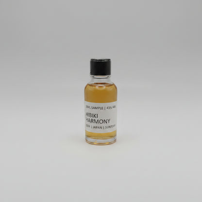 Small bottle of Hibiki Harmony whisky sample on a light gray background