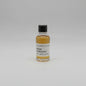 Small bottle of Hibiki Harmony whisky sample on a light gray background