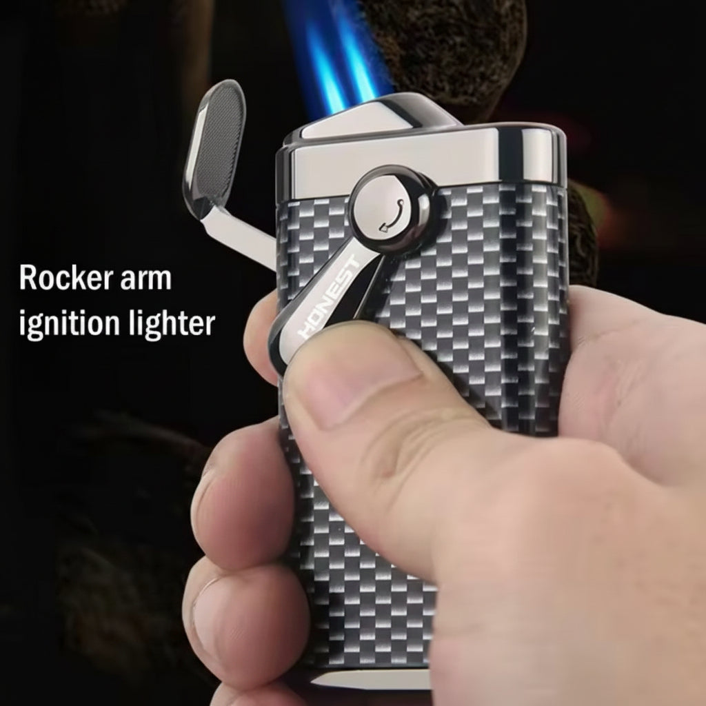 Rocker arm ignition lighter held in a hand with blurred background