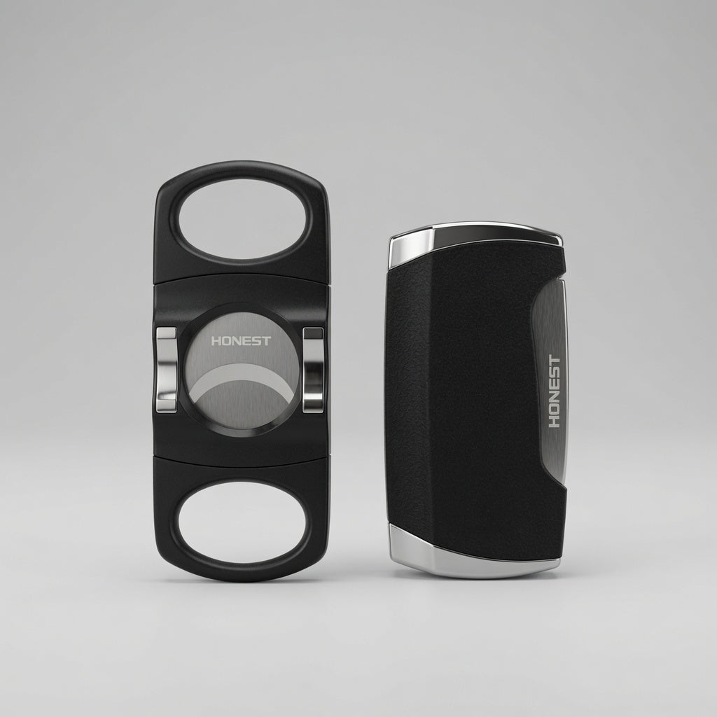 Two black cigar cutters with silver accents, shown from the front and side on a light gray background. The brand name 'HONEST' is visible on both pieces.