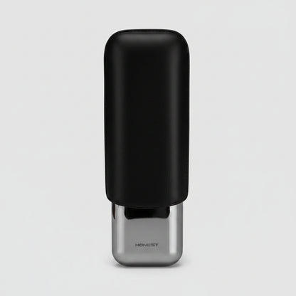 A black rectangular CIGAR case with a glossy silver metallic cap, shown on a light gray background. The brand name 'HONEST' is printed on the silver cap.