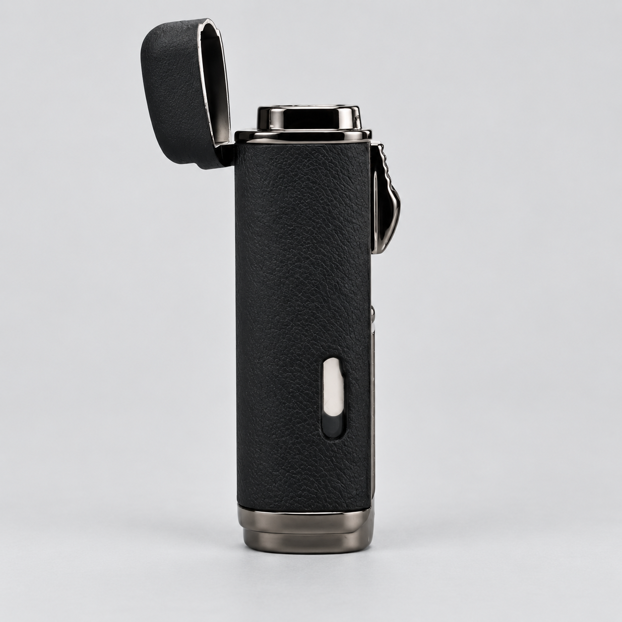 A black textured leather pocket lighter with a silver metal base and open hinged lid, shown on a light gray background.
