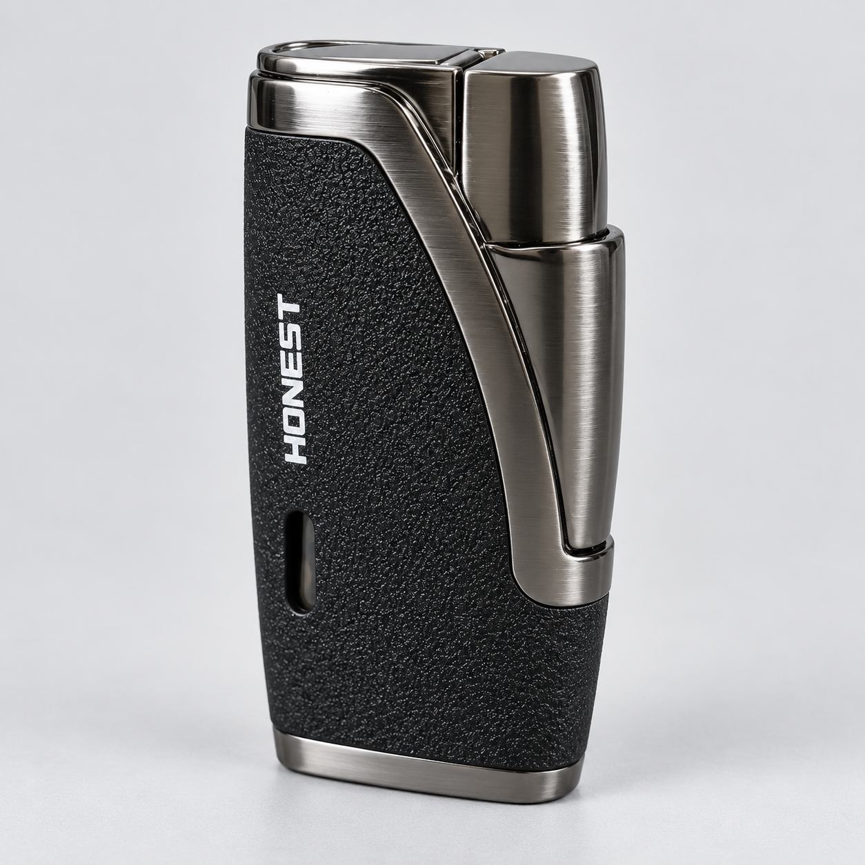 A sleek, rectangular lighter with a textured black grip and brushed silver metal accents, featuring the brand name 'HONEST' printed vertically on the side, set against a clean light gray background.