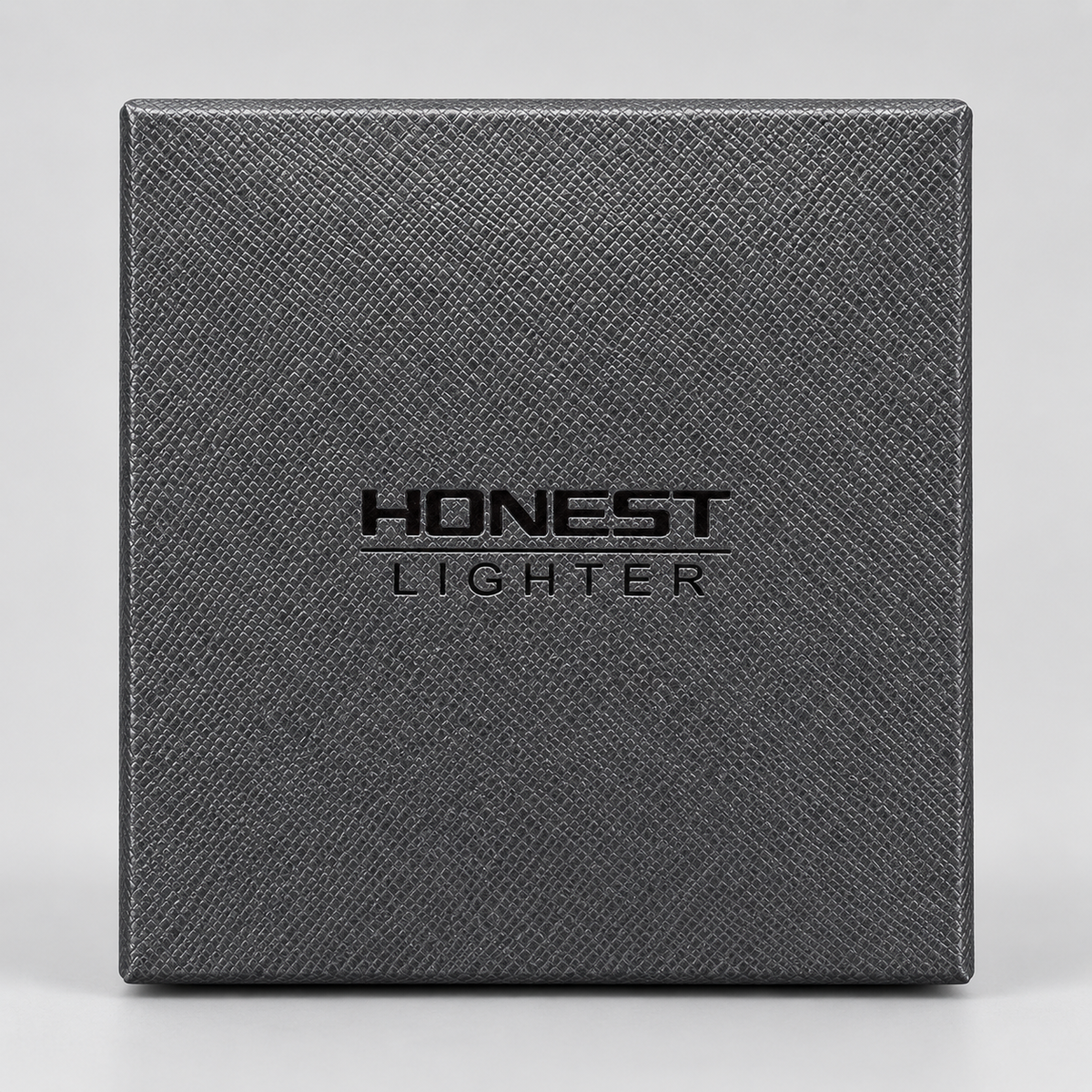 A square dark gray textured box with the embossed brand name 'HONEST LIGHTER' centered on the front, photographed against a light gray background.
