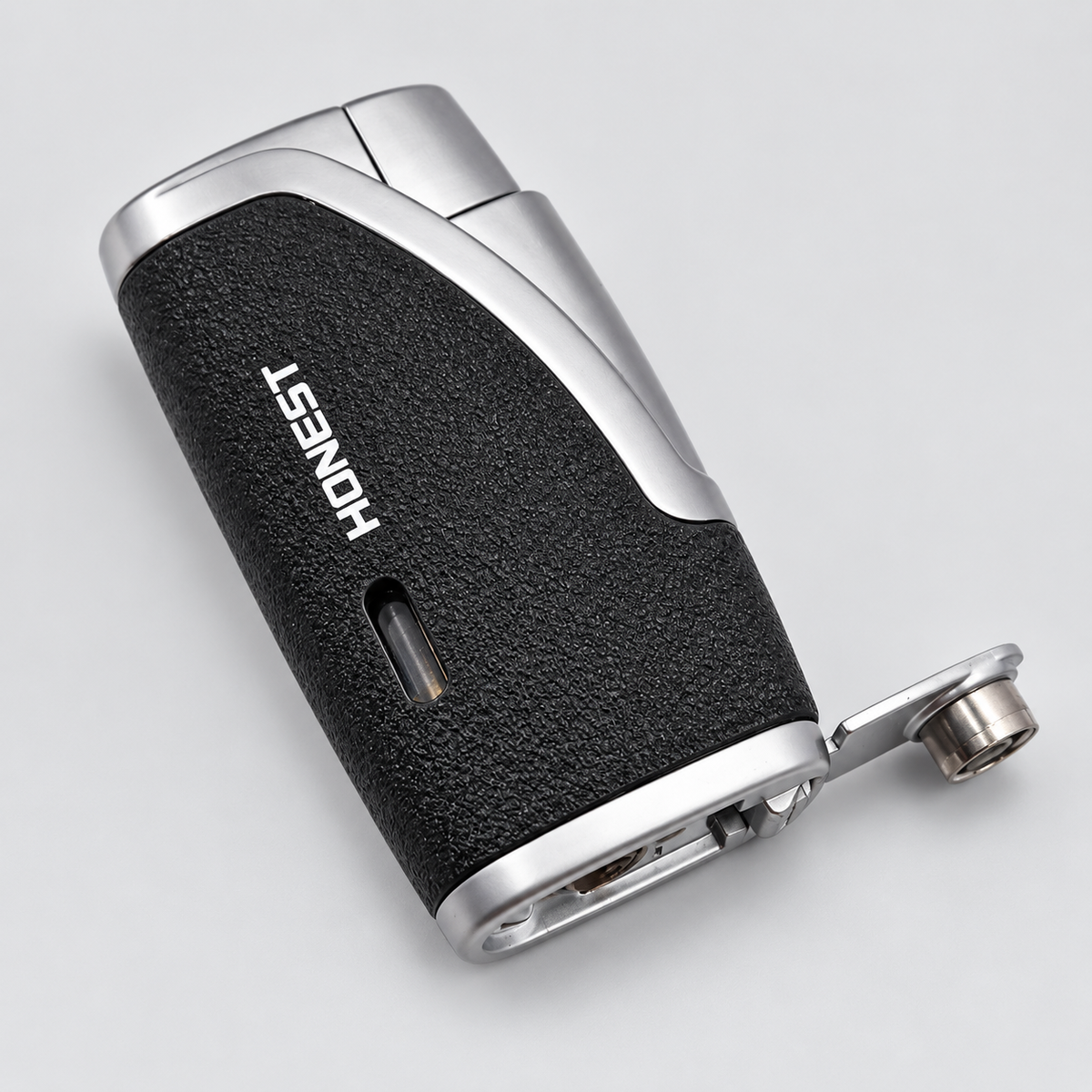 A sleek black and silver pocket lighter with a textured grip and the brand name 'HONEST' printed in white, shown on a light gray background.
