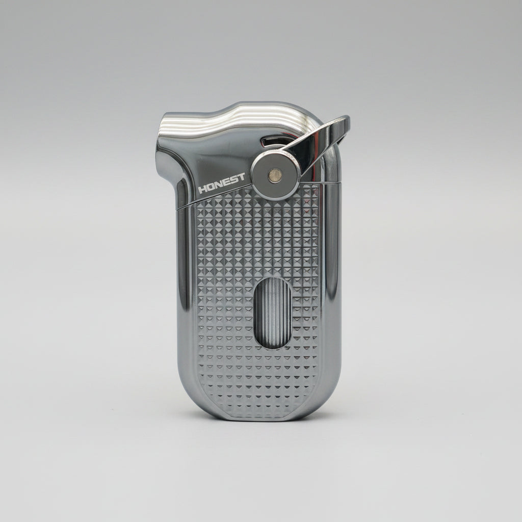 A metallic blue and silver Rocket brand lighter with a textured grip, placed on a wooden surface.
