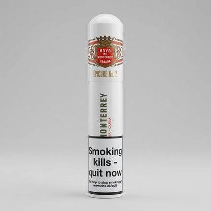 A white cylindrical CIGAR CASE labeled 'Hoyo Monterrey Reserva Epicure No. 2' with a prominent black warning label reading 'Smoking kills - quit now'.