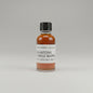 Small bottle of Blanton's Single Barrel whiskey sample on a plain background