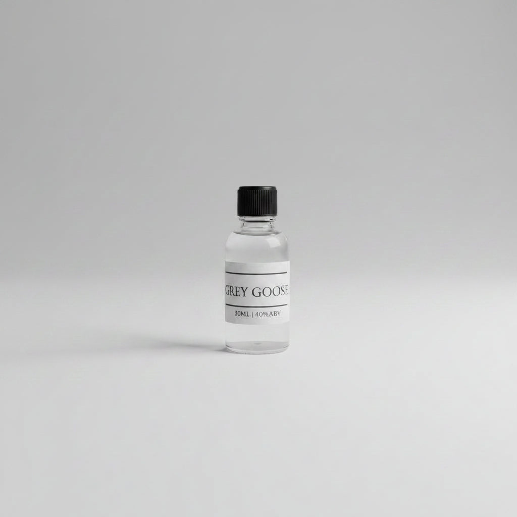 30ml sample of grey goose vodka on white background