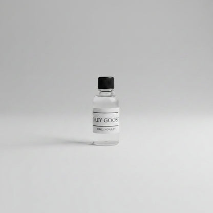 30ml sample of grey goose vodka on white background