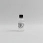 Small bottle 30ml sample of tito's vodka on a white background