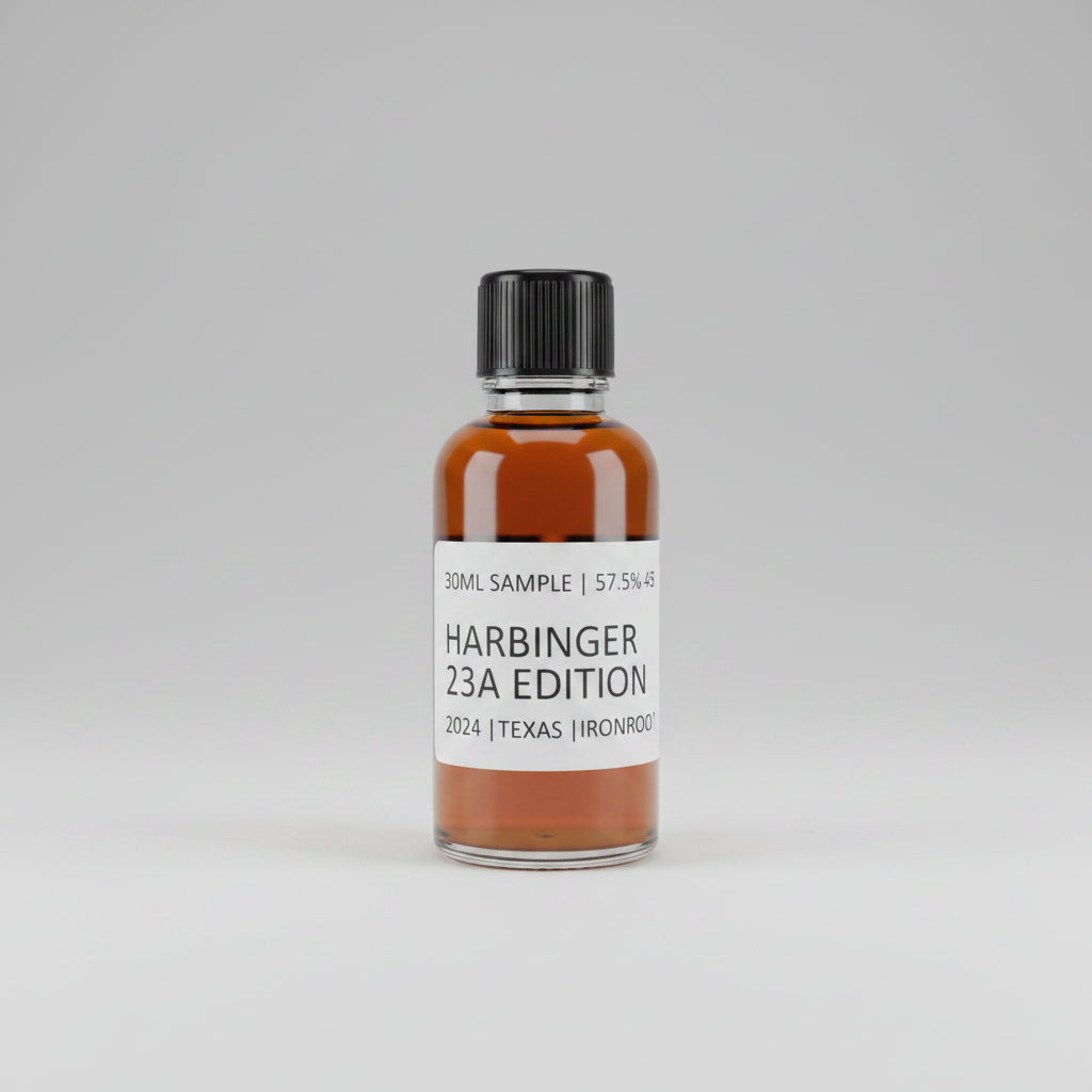 Bottle of Harbinger 23A Edition whiskey on a reflective surface with blurred background