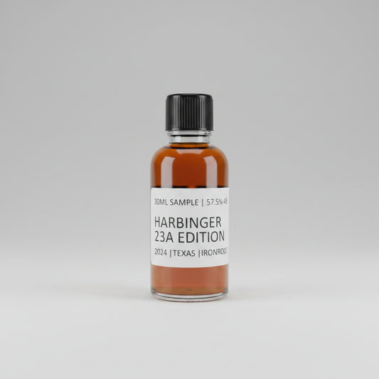 Bottle of Harbinger 23A Edition whiskey on a reflective surface with blurred background