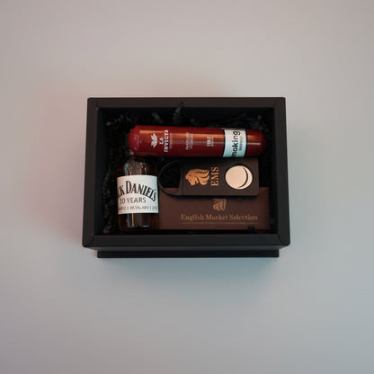 Bottle of Jack Daniel's 10 Years and a tubo cigar of La Invicta in a box with a visible brand logo.