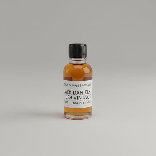 Small bottle of Jack Daniel's 1989 Vintage on a light pink background