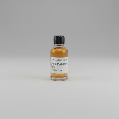 Small bottle of Jack Daniel's Fire on a beige background