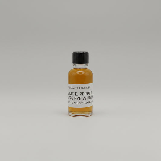Small bottle of James E. Pepper 1776 Rye Whiskey on a white background