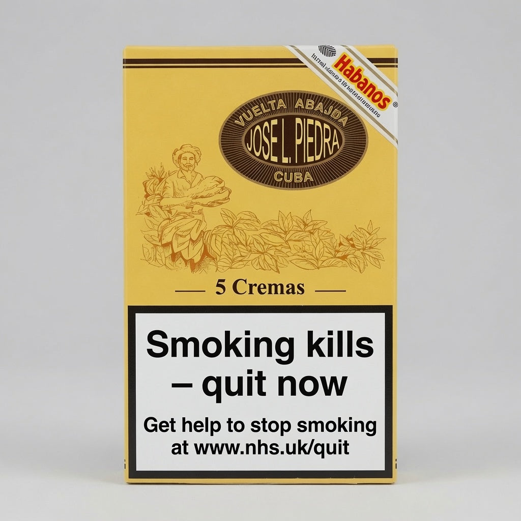 A pack of Jose L. Piedra Vuelta Abajo Cuba 5 Cremas cigarettes, featuring a yellow and brown design with a prominent health warning label on the front.