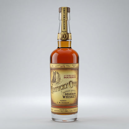 A bottle of Kentucky Owl batch 10 Kentucky Bourbon Whiskey on a light gray background.