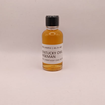 Small bottle of Kentucky Owl Wiseman on a light gray background