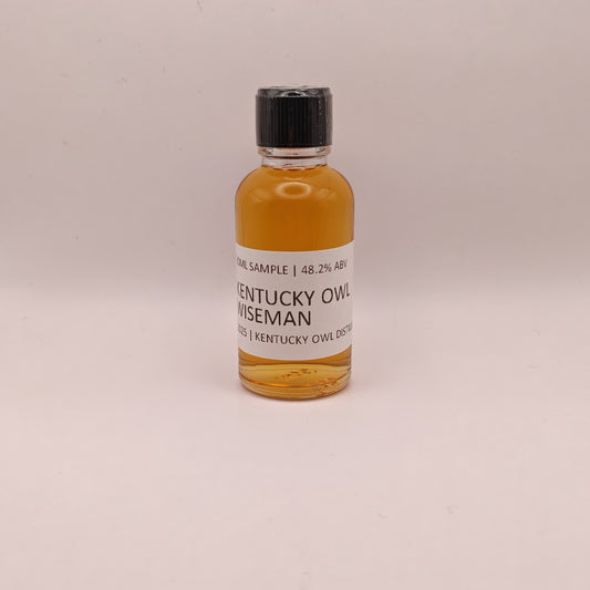 Small bottle of Kentucky Owl Wiseman on a light gray background