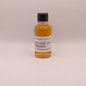 Small bottle of Kentucky Owl Wiseman on a light gray background