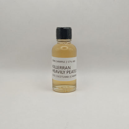 Bottle of Killerran Heavily Peated whisky sample on a light gray background
