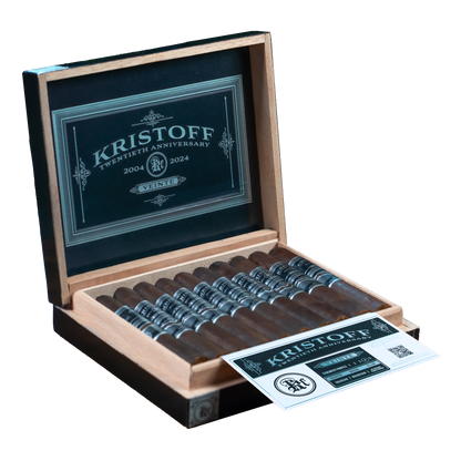 Open box of Kristoff cigars with cigars inside and a visible label on a white background