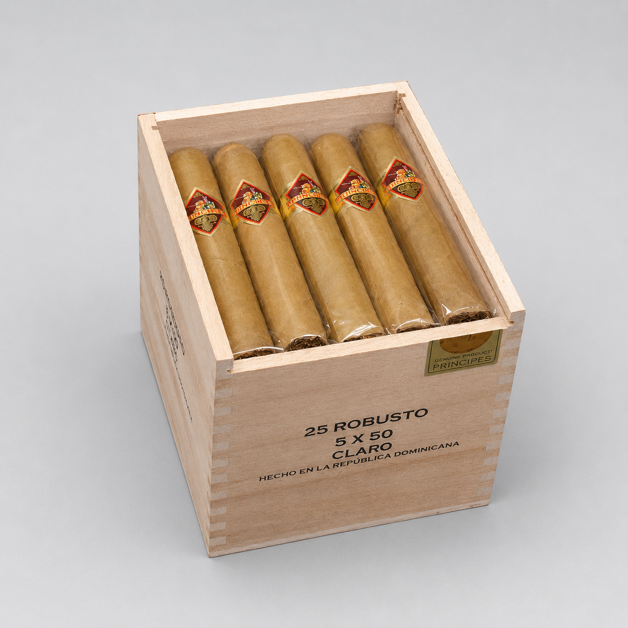 A wooden cigar box containing five cigars, photographed on a light gray studio background. The box is printed with the text '25 ROBUSTO 5 X 50 CLARO' and 'HECHO EN LA REPUBLICA DOMINICANA'.