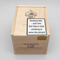 A wooden cigar box labeled PRINCIPES 25 ROBUSTO 5 X 50 CLARO, with a prominent warning sign on the lid and a gold seal, photographed on a light gray background.