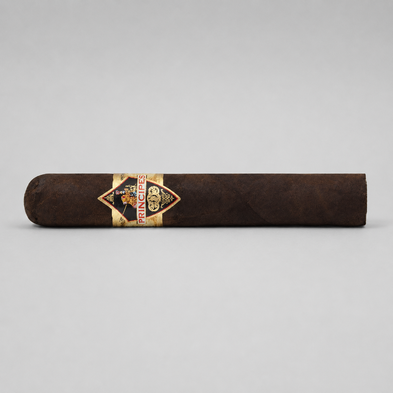 A single dark brown cigar with a gold and black diamond-shaped band reading PRINCESS, photographed horizontally against a light gray background.
