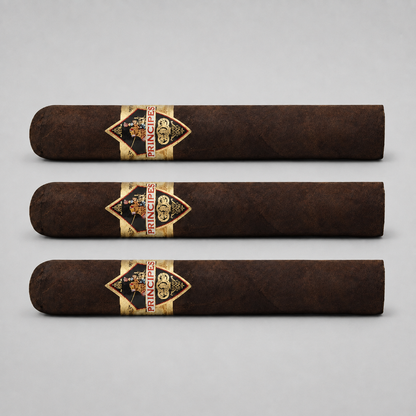 Three dark brown cigars arranged horizontally on a light gray background, each featuring a diamond-shaped gold and black Prince 500 band with red lettering.