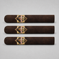 Three dark brown cigars arranged horizontally on a light gray background, each featuring a diamond-shaped gold and black Prince 500 band with red lettering.