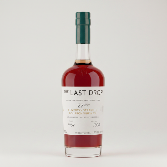 Bottle of 'The Last Drop' Kentucky Straight Bourbon Whiskey with a red liquid inside.