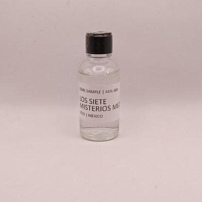 Small bottle of Los Siete Misterios Mezcal on a light gray background