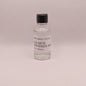 Small bottle of Los Siete Misterios Mezcal on a light gray background