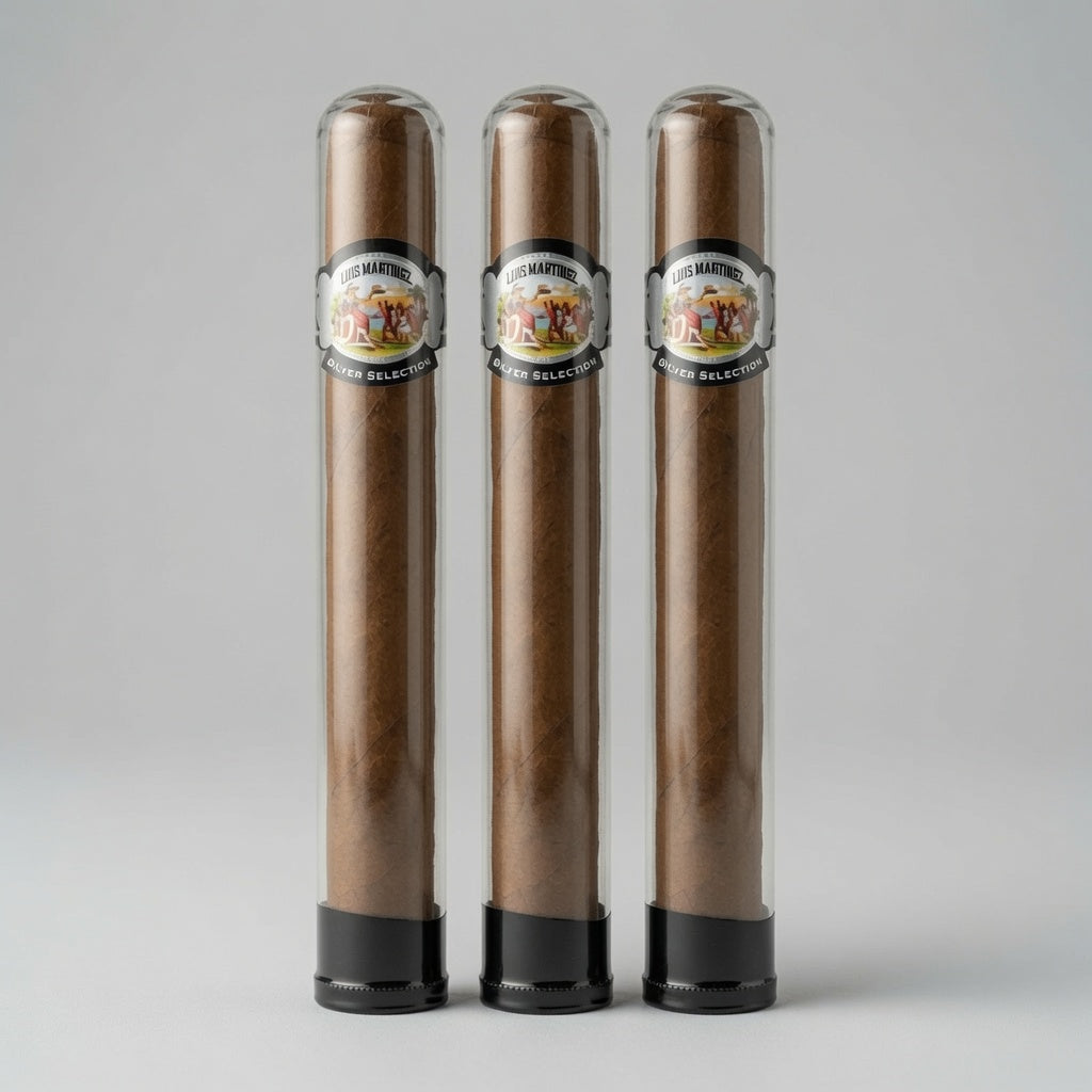 Three cigars in clear glass tubes with black bases, standing side by side on a light gray background. Each tube has a circular label reading 'Cigar Makers' and '70% Arabica'.