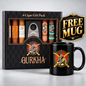 A GURKHA branded 6-cigar gift pack displayed in a black patterned box with visible cigars, a silver cigar cutter, and a black ceramic mug with a matching GURKHA graphic. A gold 'FREE MUG' badge appears on the right.