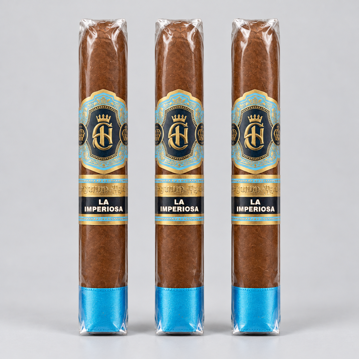 Three cigars in clear plastic wrapping with blue and gold labels reading 'LA IMPERIOSA' and a blue band at the base, shown against a light gray background.